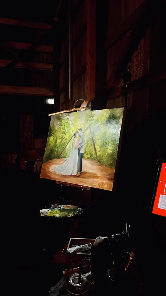 Live wedding painting during an evening reception