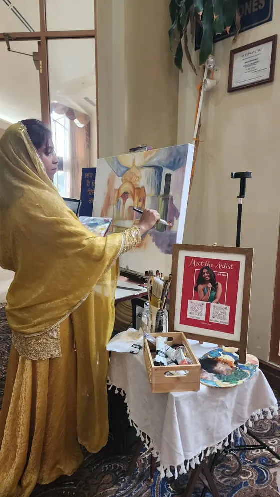 Live wedding painter at work at the venue