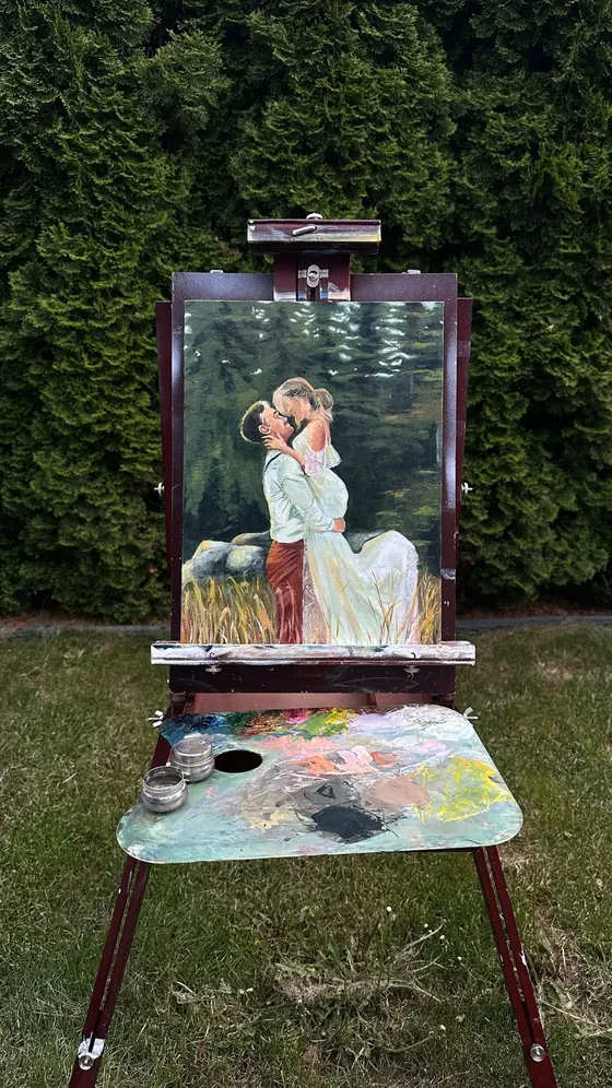 Easel set up outdoors for a live wedding painting